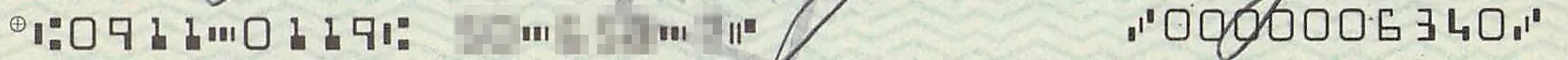 E-13B の数字と記号が並んだ帯。左に 0911 0119、右に 0000006340